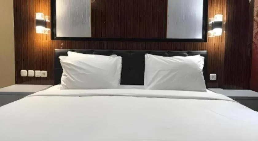 Bed in Asoka Luxury Hotel