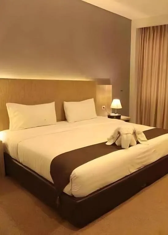 Bed in Asoka Luxury Hotel