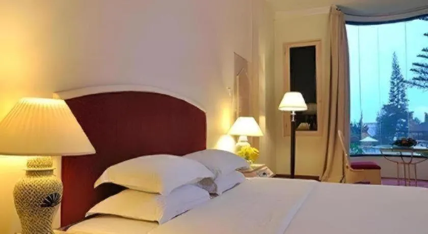 Bed in Grand Mutiara Hotel