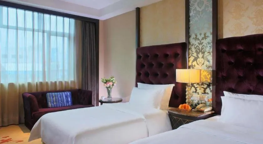 Bed in Dongguan Silver World Garden Hotel