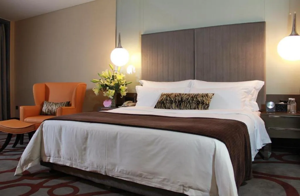 Bed in Dongguan Silver World Garden Hotel