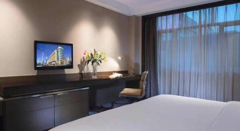 Bed in Dongguan Silver World Garden Hotel