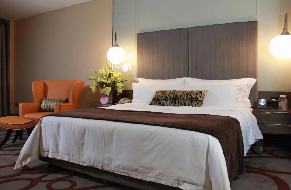 Bed in Dongguan Silver World Garden Hotel