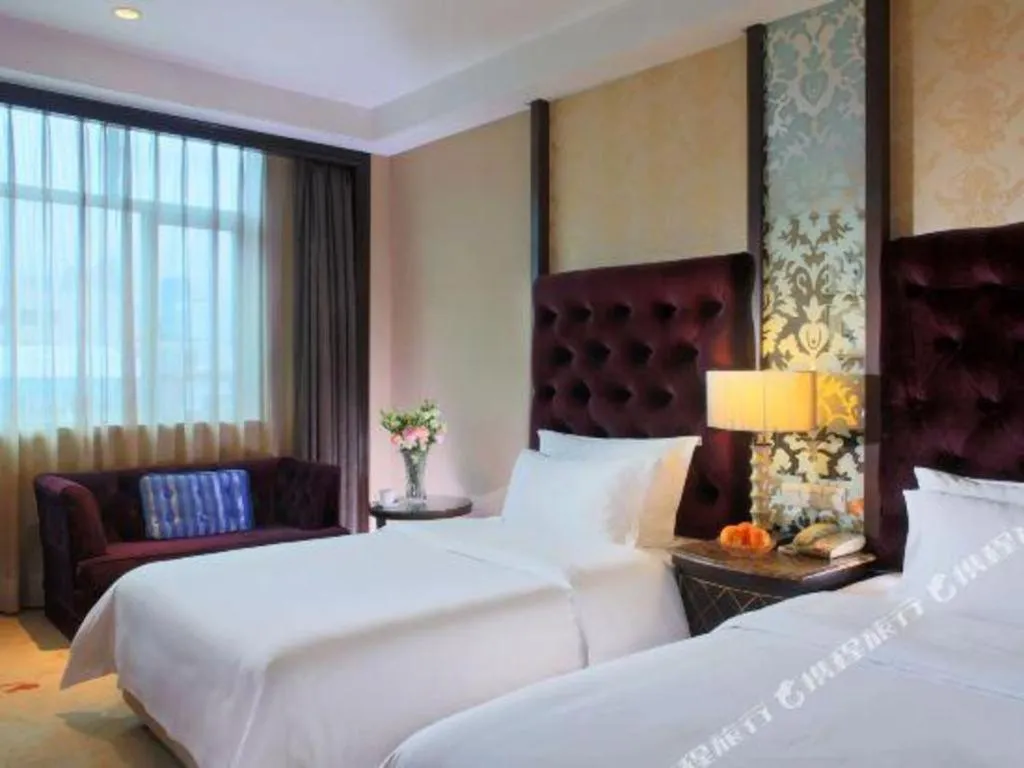 Bed in Dongguan Silver World Garden Hotel