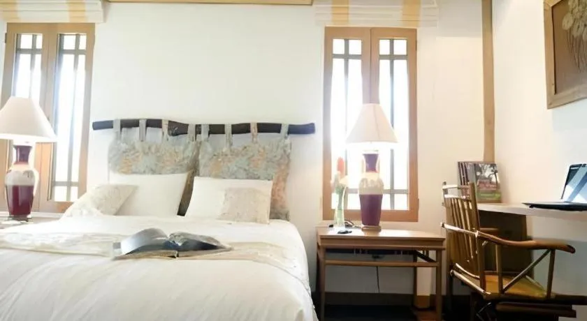 Bed in Chiangkham Luang Resort