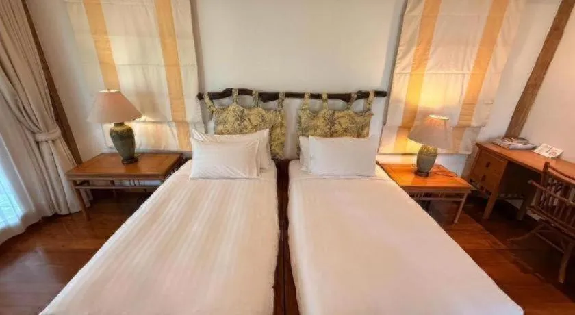 Bed in Chiangkham Luang Resort