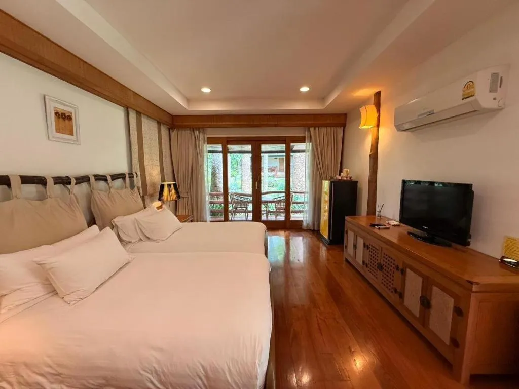 Bed in Chiangkham Luang Resort