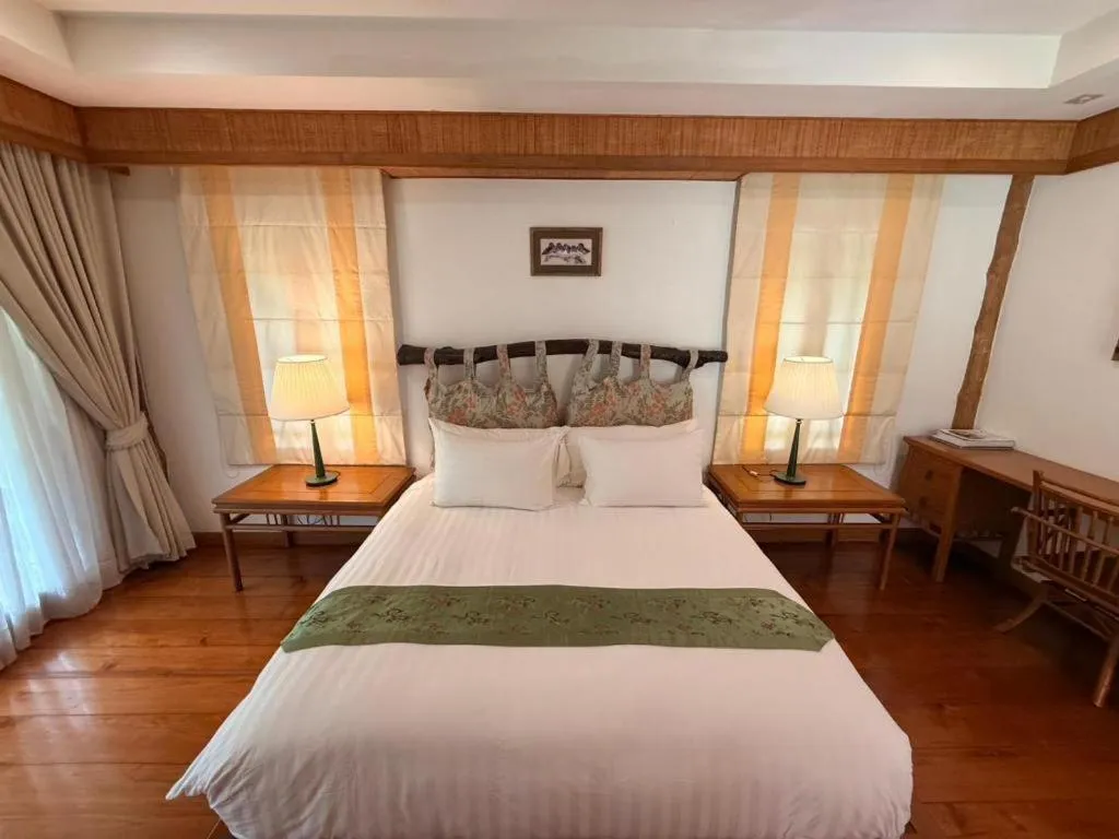 Bed in Chiangkham Luang Resort