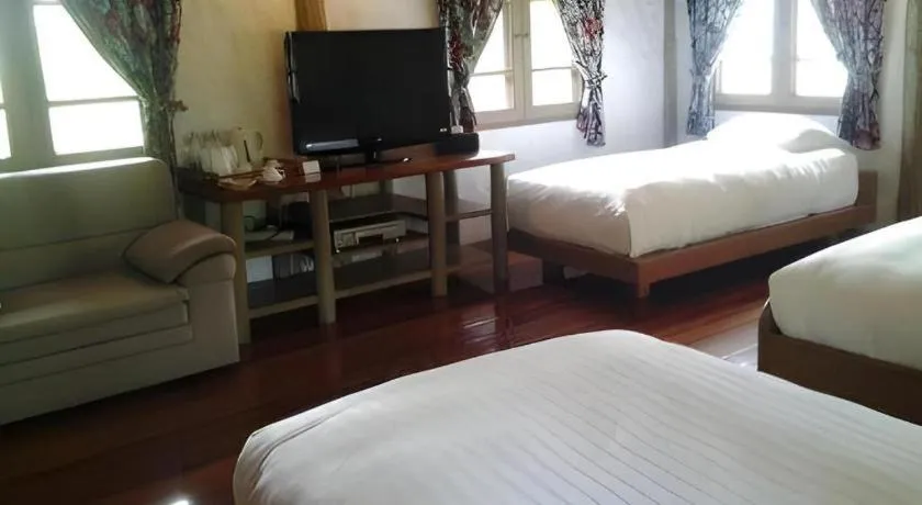 Bed in Chiangkham Luang Resort