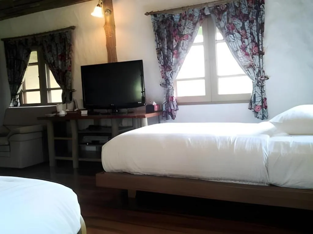 Bed in Chiangkham Luang Resort