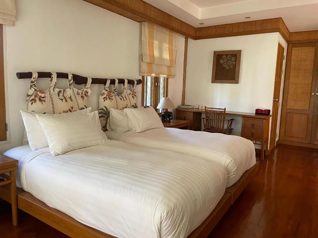 Bed in Chiangkham Luang Resort