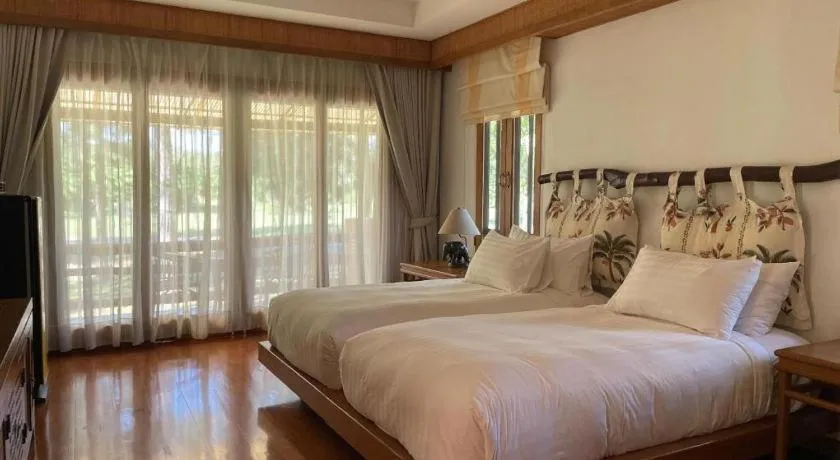 Bed in Chiangkham Luang Resort