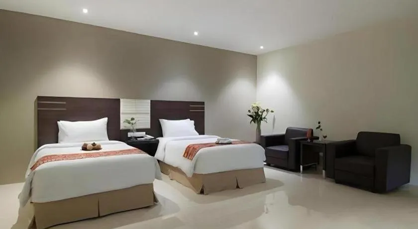 Bed in Aria Barito Hotel