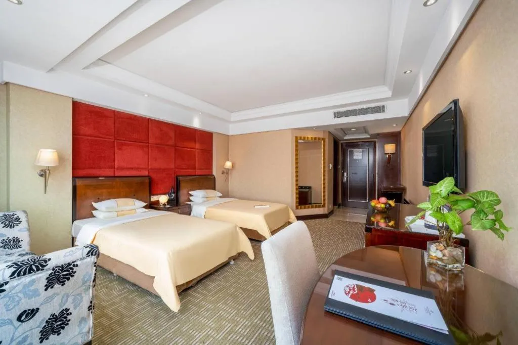 Bed in Chinflux Mandarin Hotel