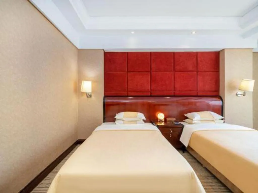 Bed in Chinflux Mandarin Hotel