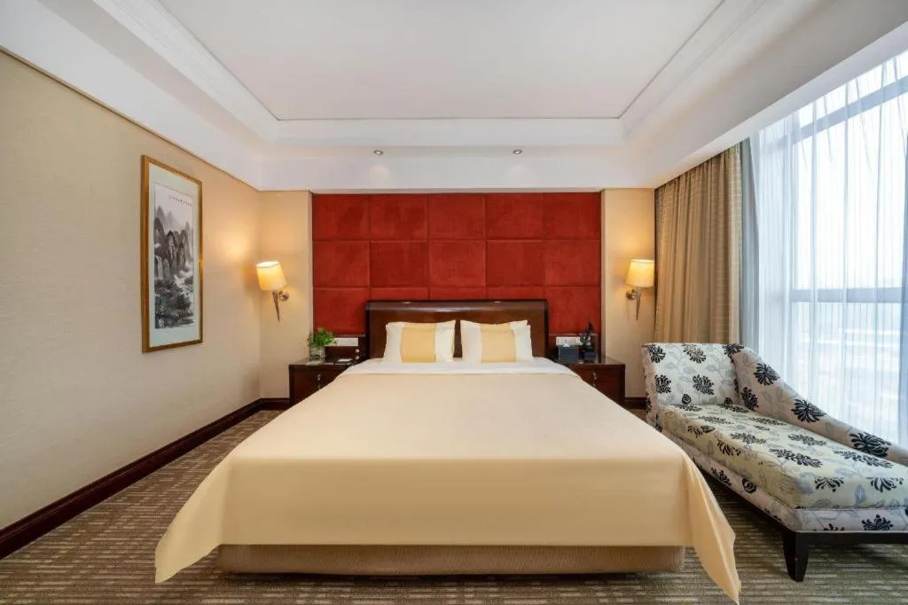 Bed in Chinflux Mandarin Hotel