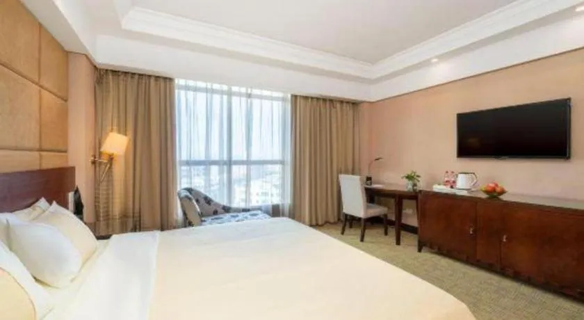 Bed in Chinflux Mandarin Hotel