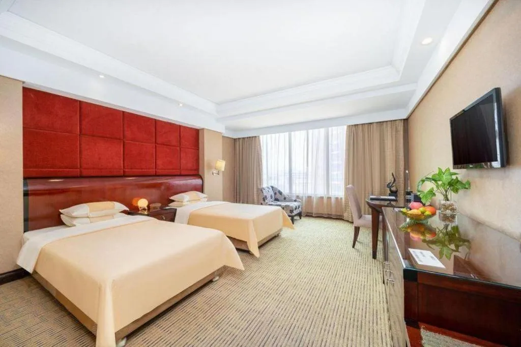 Bed in Chinflux Mandarin Hotel