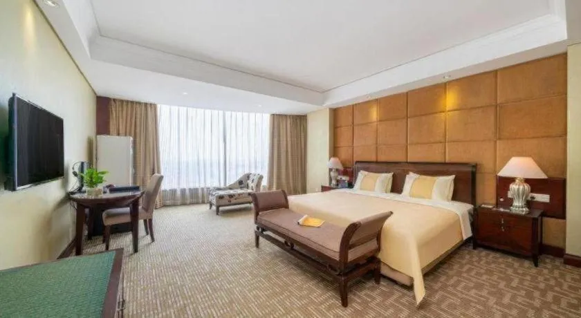 Bed in Chinflux Mandarin Hotel