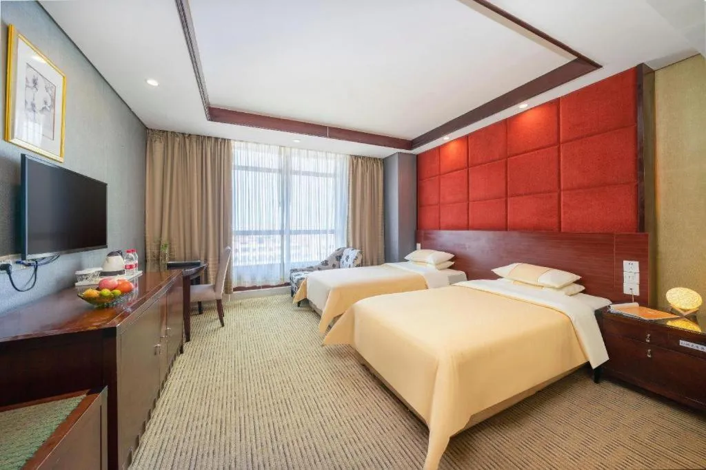 Bed in Chinflux Mandarin Hotel