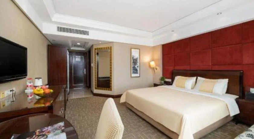 Bed in Chinflux Mandarin Hotel