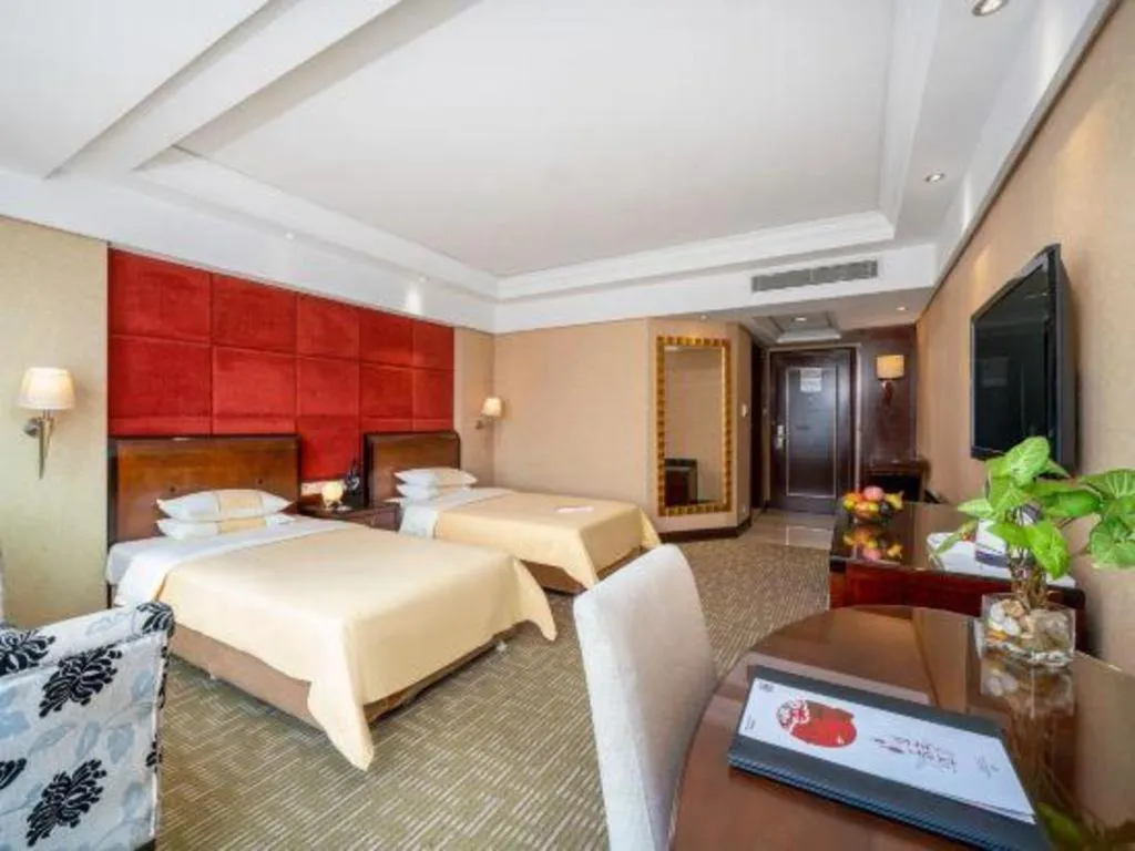 Bed in Chinflux Mandarin Hotel