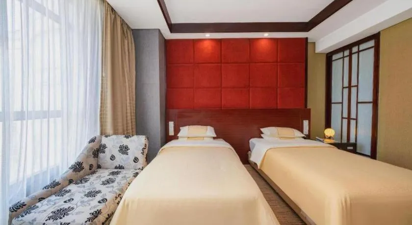 Bed in Chinflux Mandarin Hotel