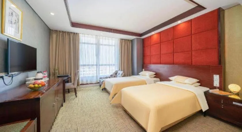 Bed in Chinflux Mandarin Hotel