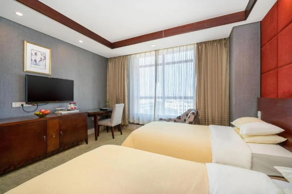 Bed in Chinflux Mandarin Hotel