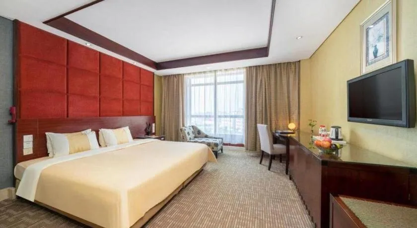 Bed in Chinflux Mandarin Hotel