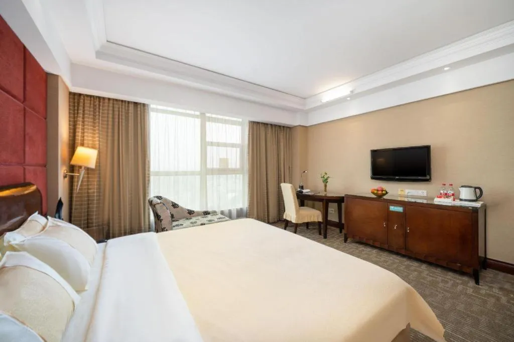 Bed in Chinflux Mandarin Hotel