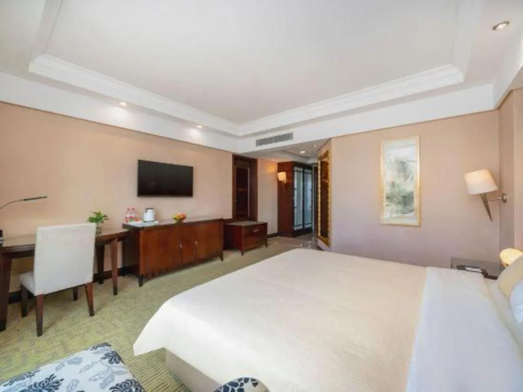 Bed in Chinflux Mandarin Hotel