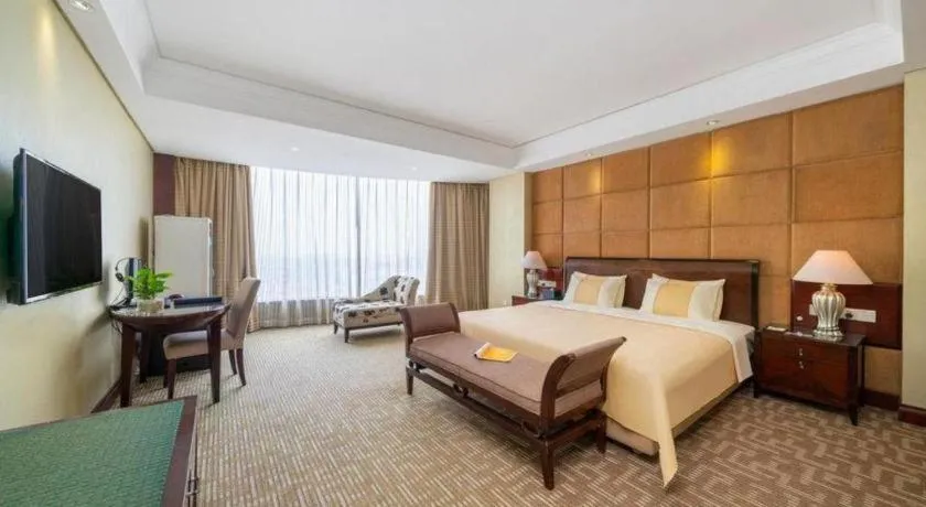 Bed in Chinflux Mandarin Hotel