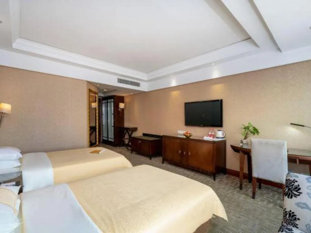 Bed in Chinflux Mandarin Hotel