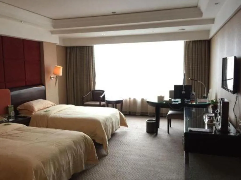 Bed in Chinflux Mandarin Hotel