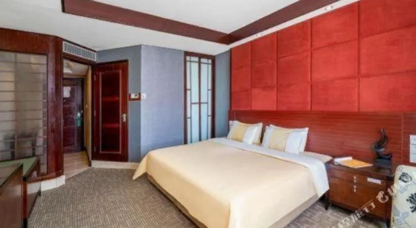 Bed in Chinflux Mandarin Hotel