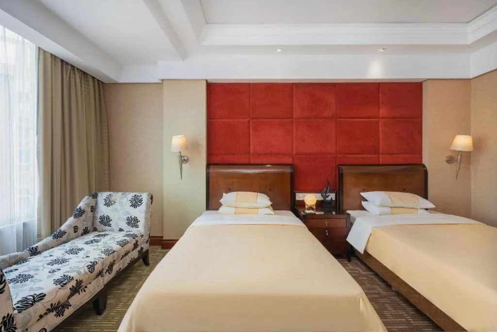 Bed in Chinflux Mandarin Hotel