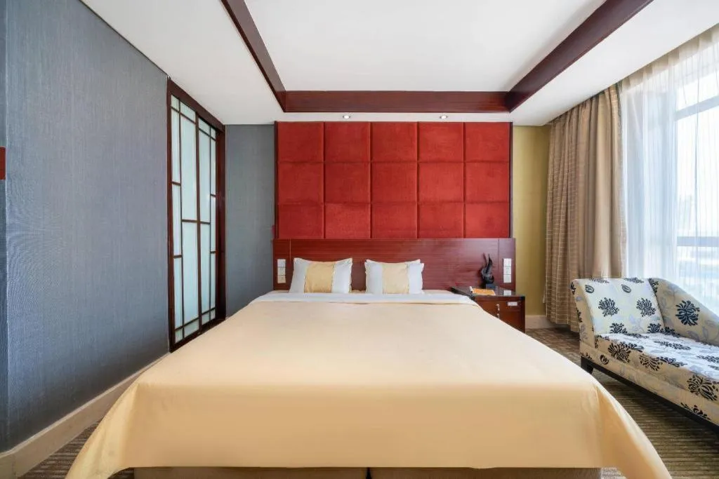 Bed in Chinflux Mandarin Hotel
