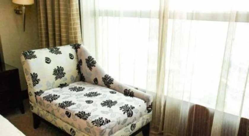 Bed in Chinflux Mandarin Hotel