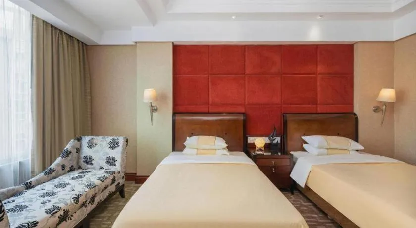 Bed in Chinflux Mandarin Hotel