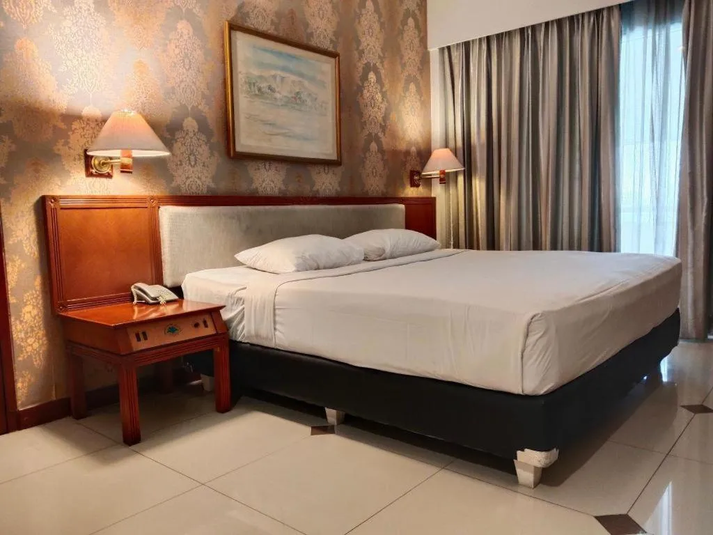 Bed in Bumi Wiyata Hotel