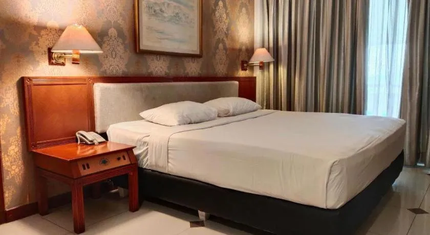Bed in Bumi Wiyata Hotel