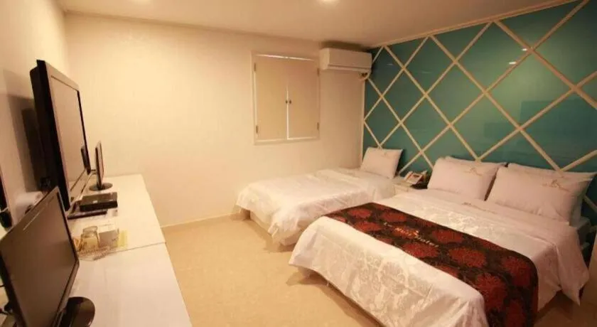 Bed in Goodstay Lanuit Hotel