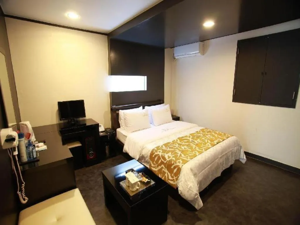 Bed in Goodstay Lanuit Hotel