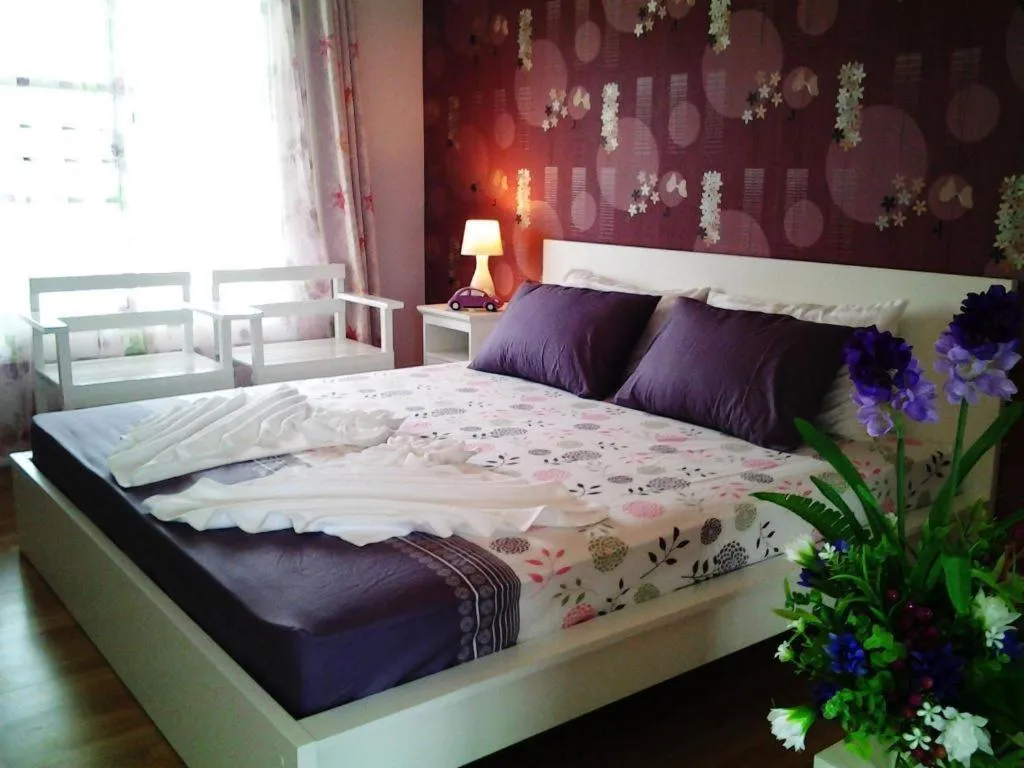 Bed in Chiangkhan Gallery Resort