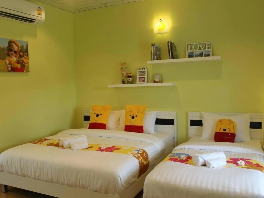 Bed in Chiangkhan Gallery Resort