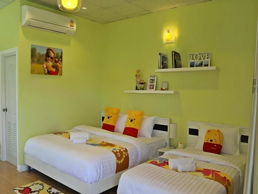 Bed in Chiangkhan Gallery Resort