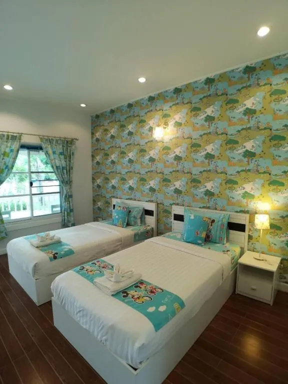 Bed in Chiangkhan Gallery Resort