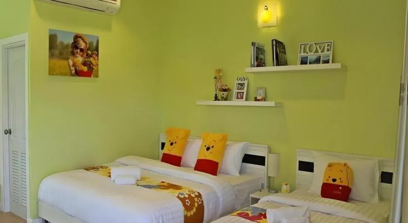 Bed in Chiangkhan Gallery Resort