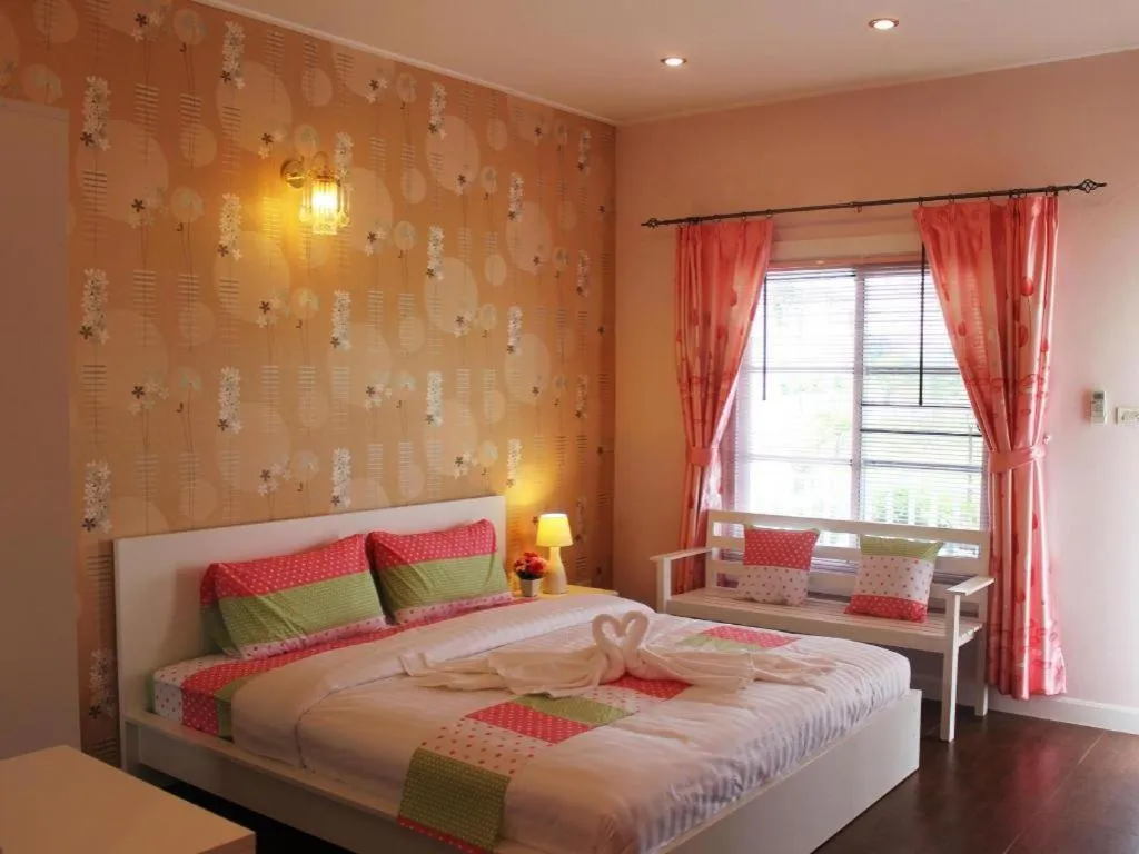 Bed in Chiangkhan Gallery Resort